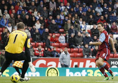 Blackburn keeper Paul Robinson saves well from Stewart Downing of Aston Villa